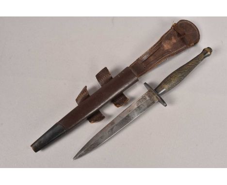 A Fairbairn Sykes 2nd Pattern Fighting knife, by Wilkinson Sword, complete with scabbard