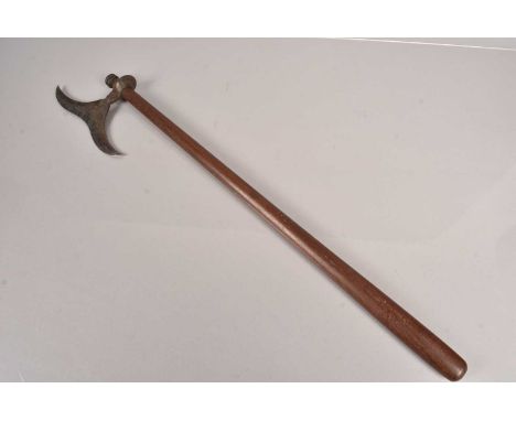 An Indo Persian Axe, having moustache shaped head, attached to a later 68cm long tapering wooden shaft