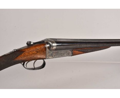 An E.J Churchill (GUNMAKERS) Ltd 12 Bore side by side shotgun, serial 7287, marked Nitro Proof, with multiple Proof Stamps, 2