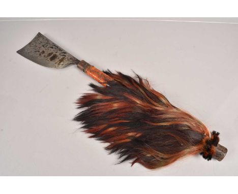 An Indian Naga Dao Chopper Axe, having applied hair decoration to the handle, 76cm