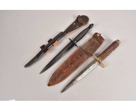 A Post War 3rd Pattern Fairbairn Sykes fighting knife, by J Nowill & Sons, having the crossed keys and asterisk 'D', with sca