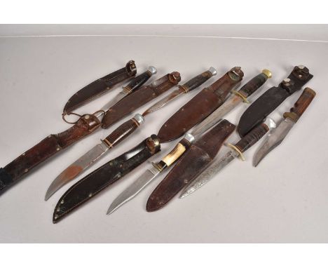 A selection of hunting knives, including two with FS style blades, one by William Rodgers, the others all of similar design, 