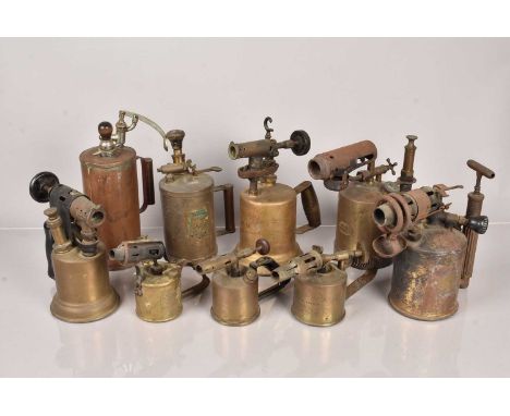 A collection of vintage blow torches, including Butler 200K, Bladon, Express, Radius No.74, Silvert, Dion-Wal, R Melhuish Ltd
