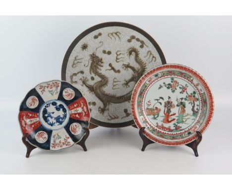 A Chinese pottery crackle glaze charger, decorated with a dragon chasing pearls of knowledge, 33cm diameter, an Imari porcela