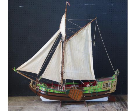 A painted wooden model of a Dutch single masted trader "Ellis 1" with two-tone hull, simulated planked decking, linen sails r