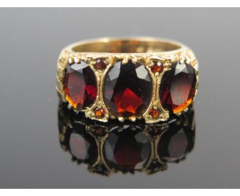 A 9ct Gold and Garnet Dress Ring, c. 21x10.5mm head, full London hallmarks, size M, 4.3g. 