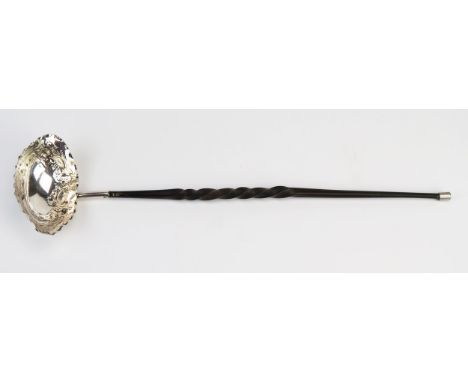 A Victorian silver oval toddy ladle, maker Aitkin Brothers, Sheffield, 1892, in the Georgian style with embossed foliate bowl