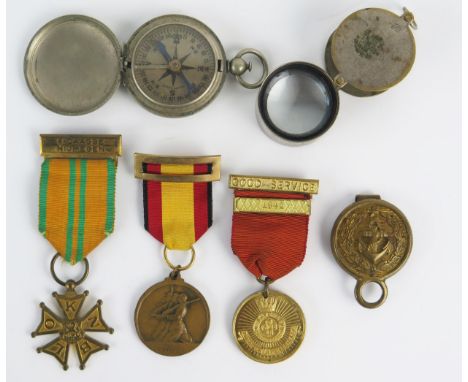 A Dutch Cross of the Four Day Marches, two other medals, an American compass, a magnifying glass, Naval hanger, (6). 