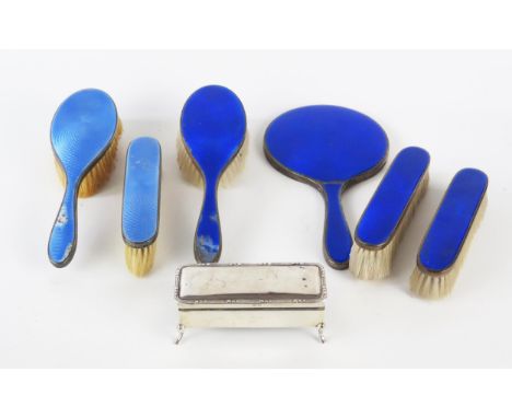 A George V silver and enamel dressing table set, Birmingham, 1929, includes hand mirror, clothes and hair brushes together wi