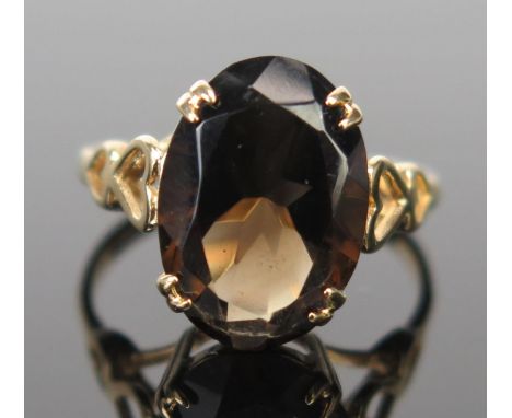 A 9ct Gold and Smoky Quartz Dress Ring, the 14x10mm stone in a claw setting, full Birmingham hallmarks, size L, 2.3g 