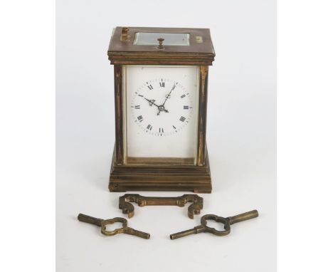 A French brass carriage clock, with 7cm roman dial, the movement with platform escapement, push repeat, striking to two gongs