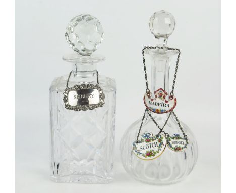 A Royal Doulton crystal glass decanter and stopper, with silver "Sherry" label, another clear glass decanter and stopper, wit