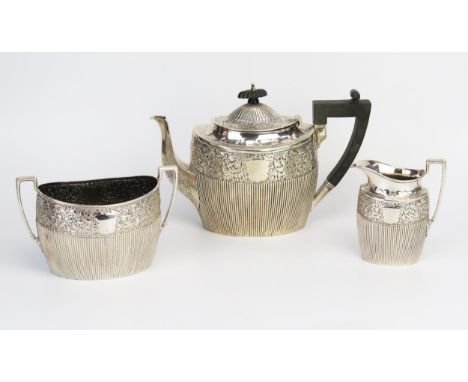 A late Victorian silver three-piece tea service, maker James Dixon &amp; Sons Ltd, Sheffield, 1891, of oval outline with band