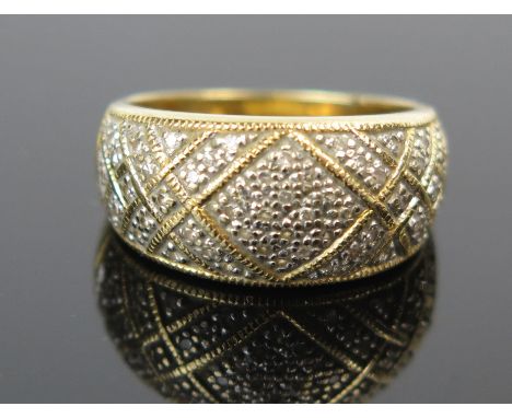 An 18ct Gold and Diamond Ring, 10mm wide head, size M.75, 5.9g 