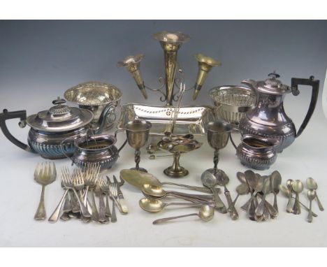 A quantity of assorted plated wares, includes; four piece tea service with half reeded decoration, epergne, rose bowls cutler