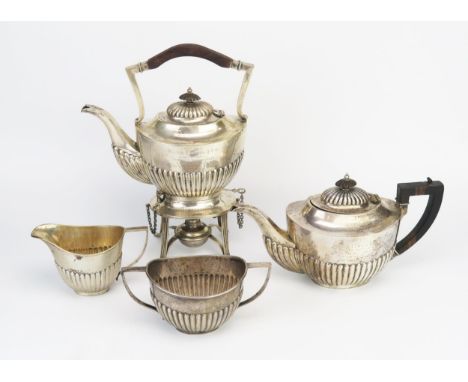 An Indian silver four-piece tea service, by Barton, Bangalore, stamped Barton, Silver, inscribed, of oval outline with half r