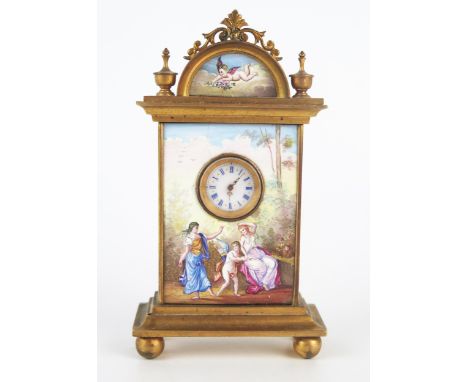 A Viennese gilt metal and enamel bedside timepiece, of arched outline, the pediment decorated with a cherub holding a spray o