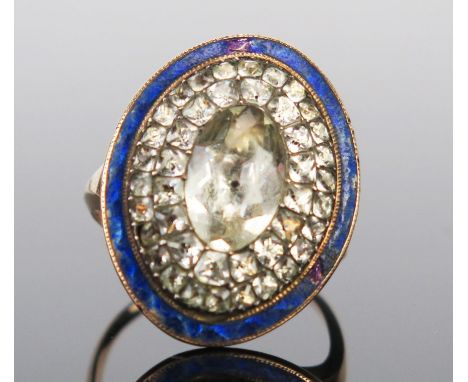 A Georgian Paste and Blue Enamel Ring in an unmarked high carat gold setting, c. 23.5x18mm head, size M, 6.5g 