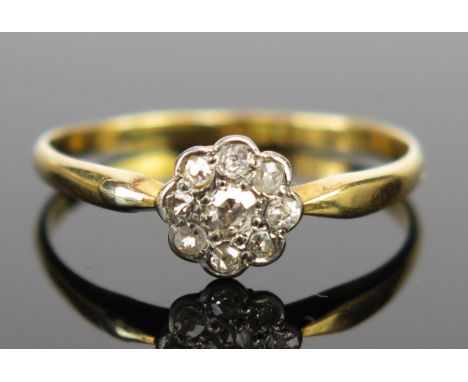 An 18ct Gold and Diamond Daisy Head Ring, Birmingham 1920, 7mm head, size O.5, 1.5g 