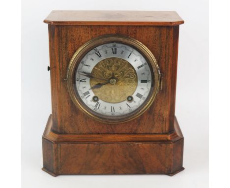 A walnut and brass strung mantel clock, of rectangular outline, with canted corners, with 12cm silvered chapter ring with Rom