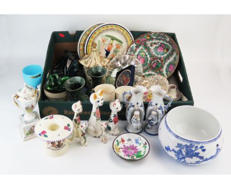 A collection of ceramic wares including Poole pottery dolphins, Quimper ware plates, Wemyss style pottery cats etc. 
