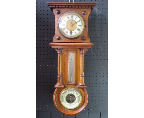 An Edwardian mahogany combination wall timepiece, of rectangular outline, with dentil moulded cornice and fluted half columns