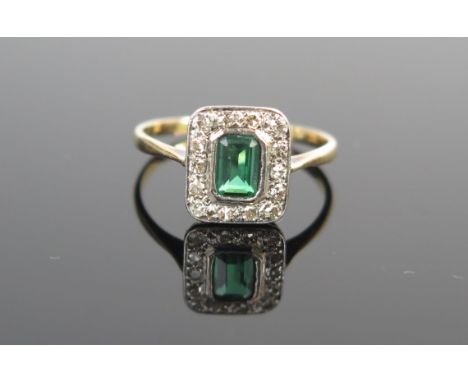 An Emerald? and Diamond Ring in an unmarked gold mount, size K, 1.9g 