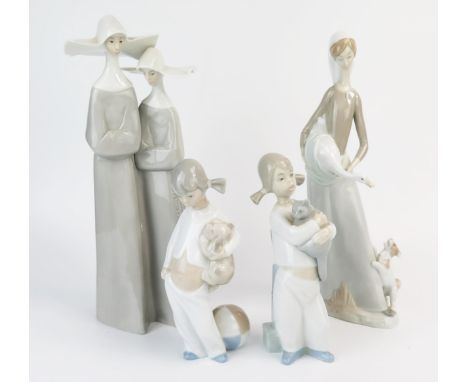 Lladro figural group of two nuns in conversation, 32cm high, a Nao porcelain figurine of a goose girl, and two smaller porcel