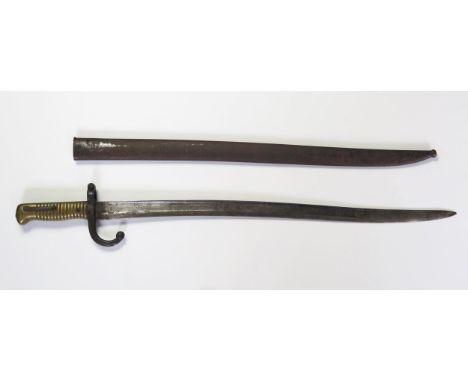 A 19th century French Chassepot bayonet, with 57.5cm curved and fullered single edge blade, dated 1875, with ribbed brass gri