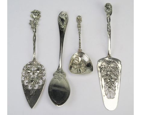 Two continental silver slices, each with pierced and foliate decorated blades, a Victorian silver slice and a continental sil