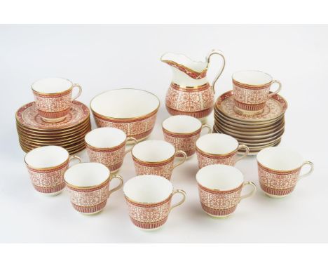 A Minton porcelain part tea service with banded pink scrolling pattern decoration, includes, cups, saucers, cream jug and sug