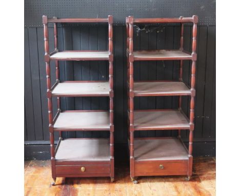A matched pair of 19th century mahogany five tier whatnots, each square tier raised on ring turned supports, with single draw