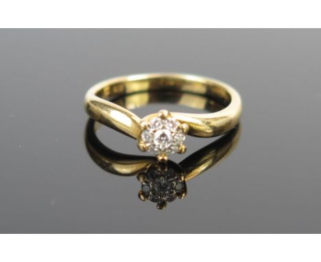 An 18ct Gold and Diamond Cluster Ring, 0.10ct, 6mm head, size J.5, 2.8g 