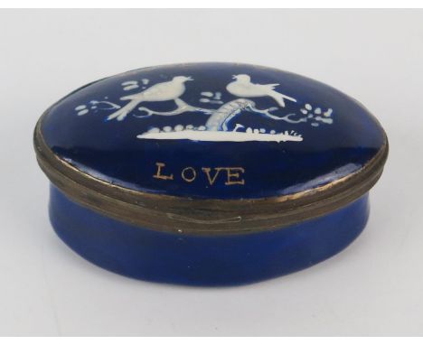 A 19th century blue enamel patch box inscribed Love for Love with two love birds in white low relief, the lid with mirror pla
