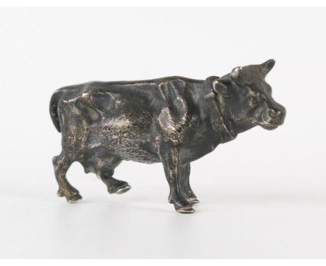 An Elizabeth II silver model of a cow, makers mark indistinct, London, 1969, 6cm long, 87gms, 2.82ozs 