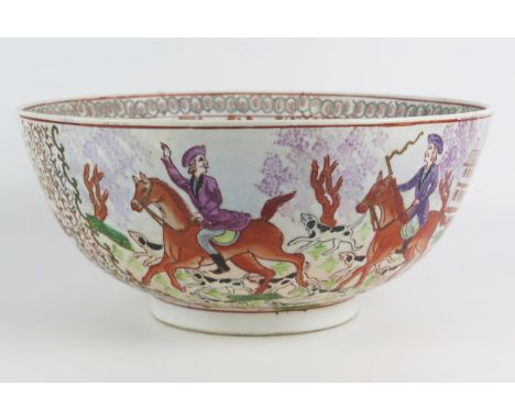 A large Chinese porcelain bowl, decorated in polychrome enamels in the European taste with hunting scenes includes mounted hu