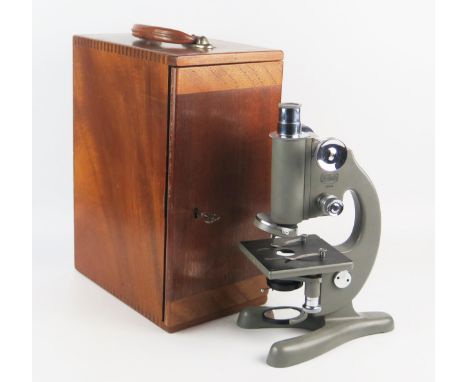 Beck, London, a Model 47  grey enamel monocular microscope, with fine and course rack and pinion focussing, triple revolving 