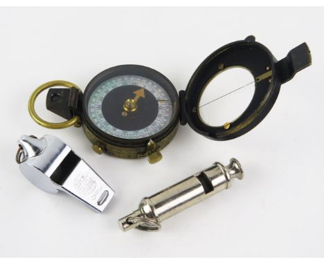 A Verners Patent 11A compass together with two whistles. 