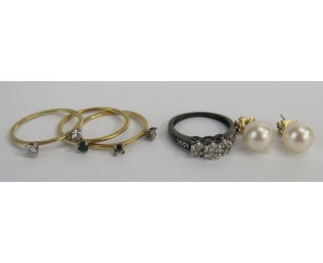 A 9ct Gold and Diamond Ring, three unmarked diamond rings (one A/F), green paste ring, pair of untested pearl earrings and si