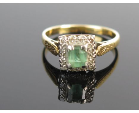 A Diamond and Green Stone Ring in an unmarked gold setting, size M.75, 4.2g 