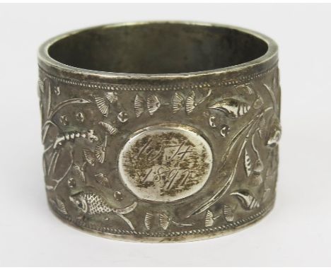 A Chinese silver napkin ring, maker Luen Hing, Shanghai, initialled, decorated with shells and fish, 44gms, 1.43ozs, 