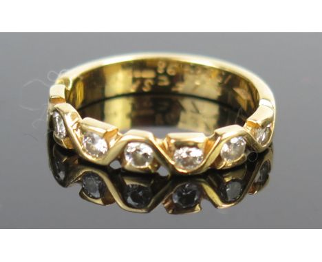 An 18ct Gold and Diamond Seven Stone Half Eternity Ring, c. 3.6mm wide, size L.25, 3.4g 