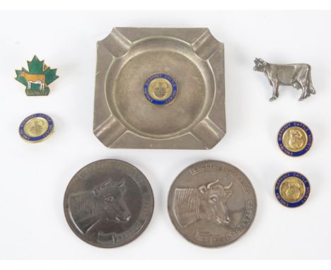 A mixed collection of silver and metal wares, includes medallion, badge, plated ashtray and enamel badges for the English Gue