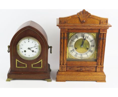 A mahogany and brass strung lancet-shaped mantel clock, with 10cm Arabic/Roman dial, the circular movement striking to a gong