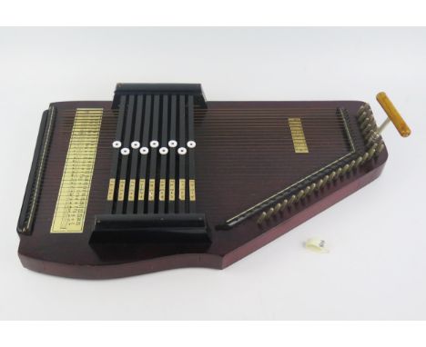 A Scala auto-harp, with tuning key, 52cm long. 