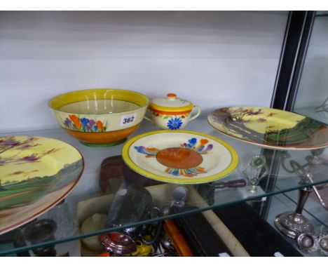 A CLARICE CLIFF BIZARRE CROCUS PATTERN BOWL, A SIMILAR PLATE, TWO DOULTON SERIES WARE PLATES AND A CHOCOLATE CUP AND COVER. 