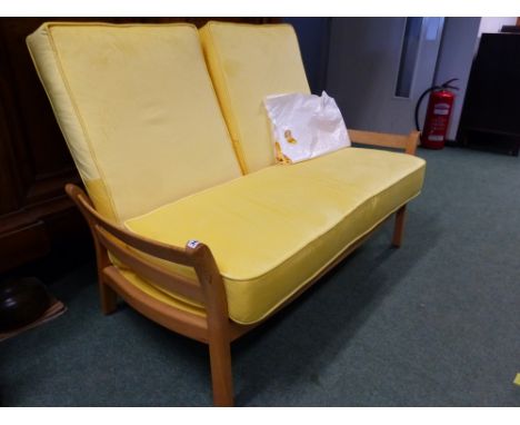 AN ERCOL SMALL COTTAGE SETTEE. 