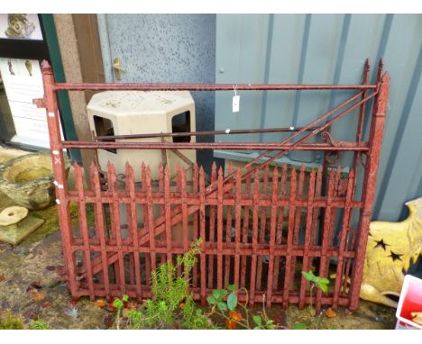 A PAIR OF GOOD QUALITY PAINTED IRON DRIVEWAY GATES AND ONE OTHER IRON GATE.