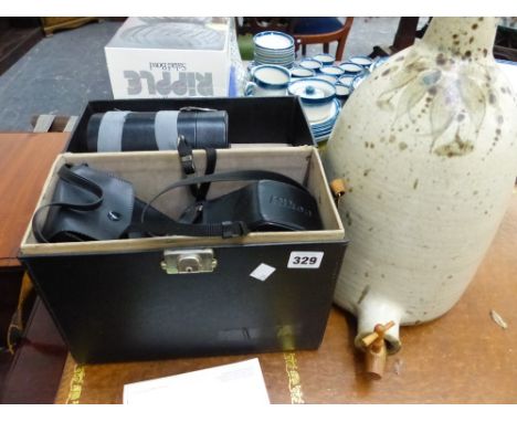 A NIKON SLR CAMERA, AND A STONEWARE FLAGON.