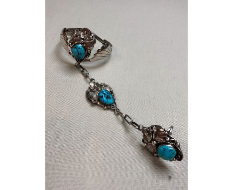 AN ARTISTS SIGNED NAVAJO NATIVE AMERICAN TURQUOISE AND SILVER BANGLE AND ATTACHED RING SET FOR ANDERSON EDSITTY. 